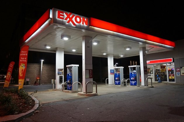 Exxon said to sue California over green disclosure laws (XOM:NYSE) Lonely Gas Station at Night