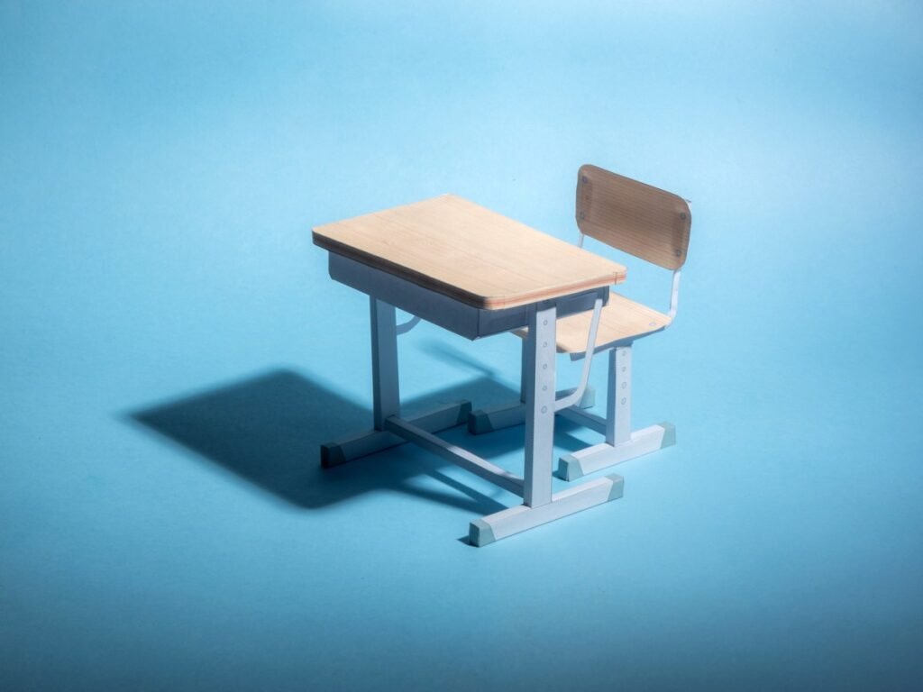 High school’s AI security system confuses Doritos bag for a possible firearm Empty school desk on a blue background. .