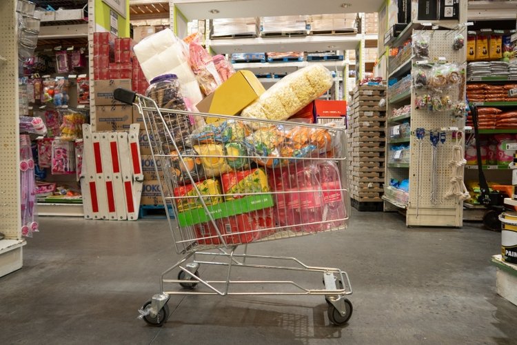 Weekly consumer staples check: Bungee Global and Estee Lauder tops chart Trolley filled with groceries in wholesale store Landscape